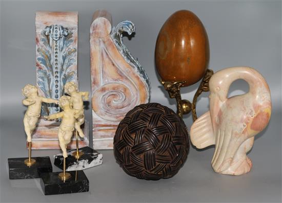 A small group of collectables, book ends, egg on stand, 3 putti on stands etc